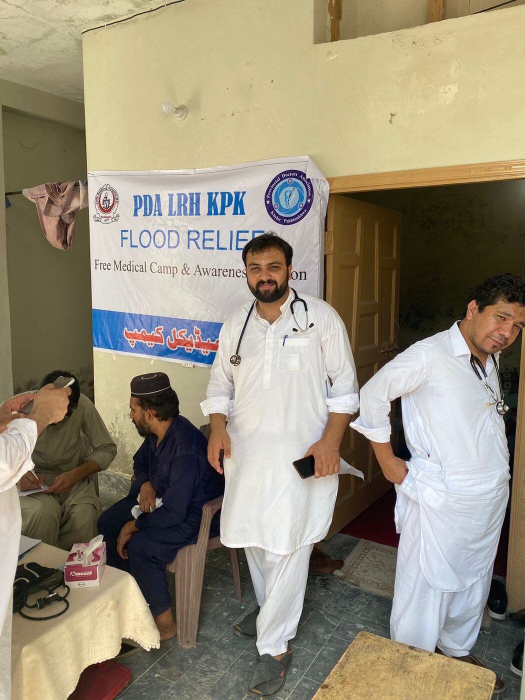 Volunteer doctors attending patients during a community visit