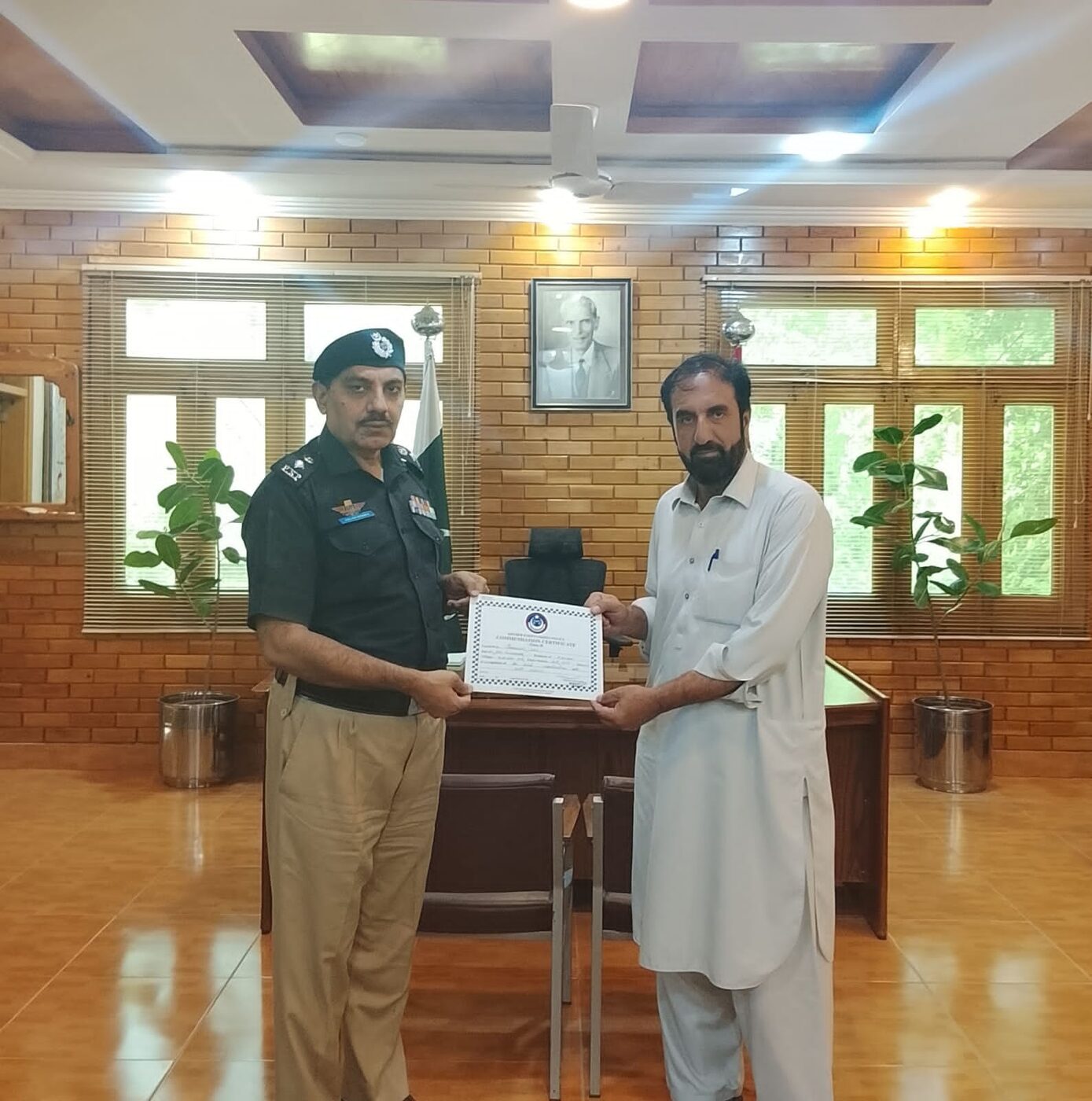 A framed recognition presented to a volunteer doctor